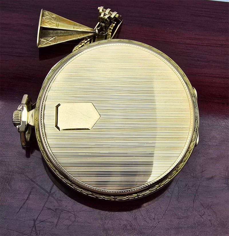 Używany, złoty (14k) zegarek kieszonkowy DOXA pięknie zdobiony z dewizką